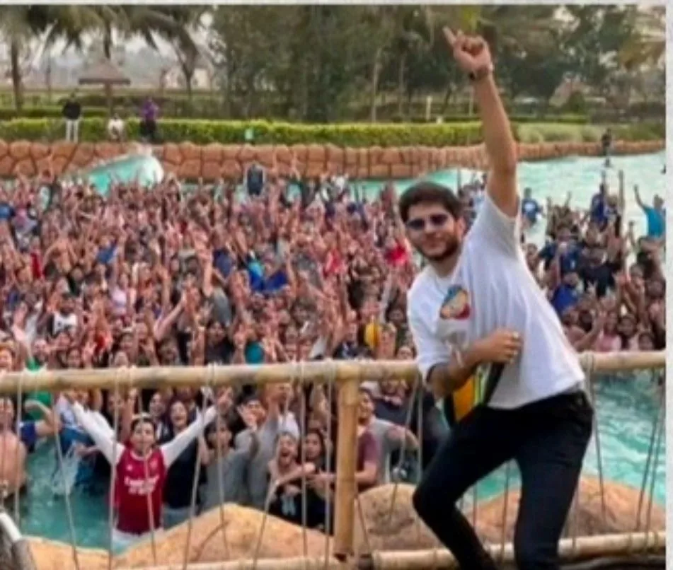 SHIKO performing with arms raised